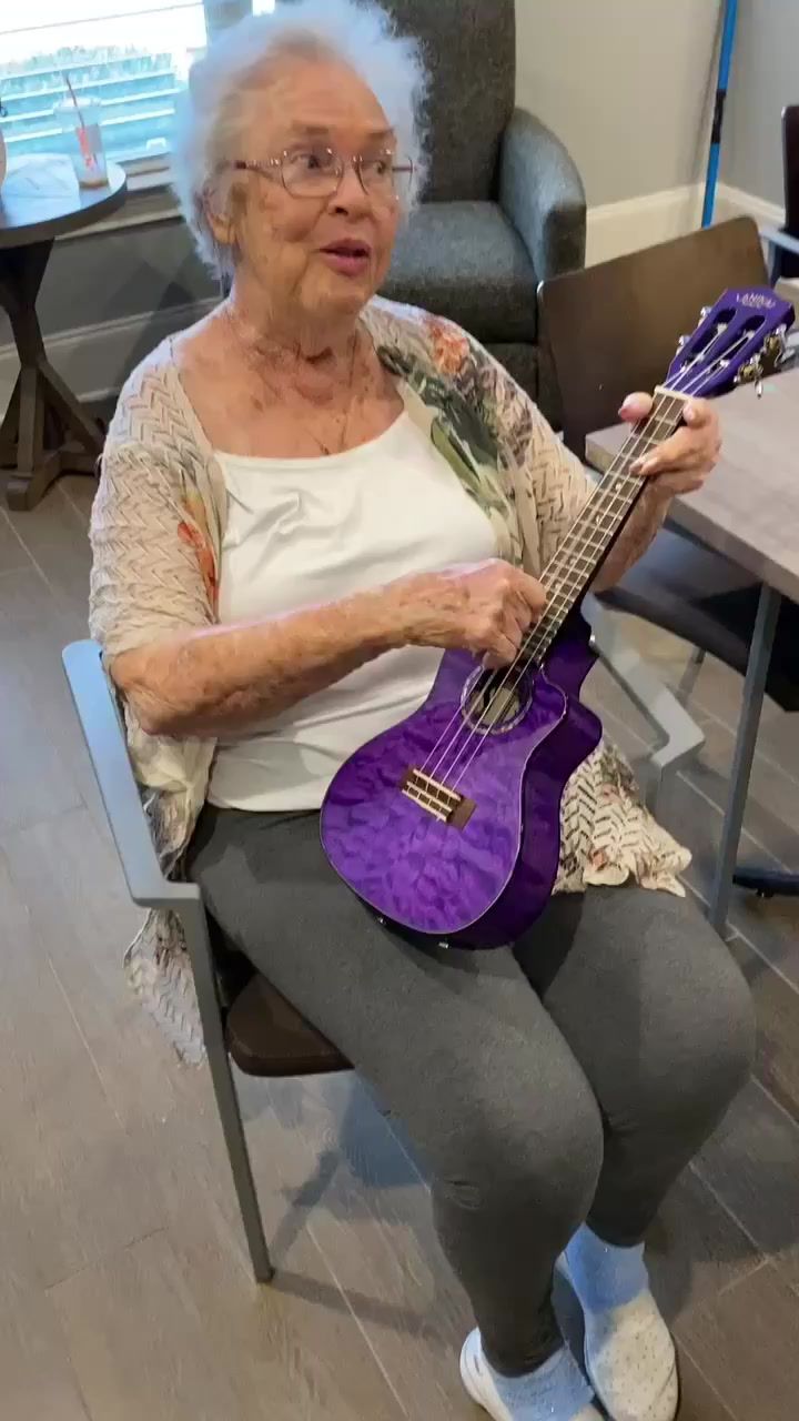 A resident named Fran playing a purple ukulele