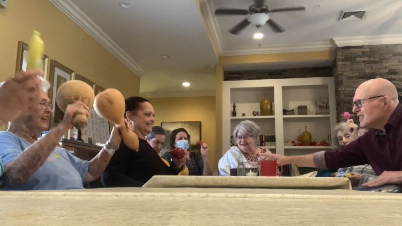 Residents in Alzheimer’s care playing shakers and percussion instruments
